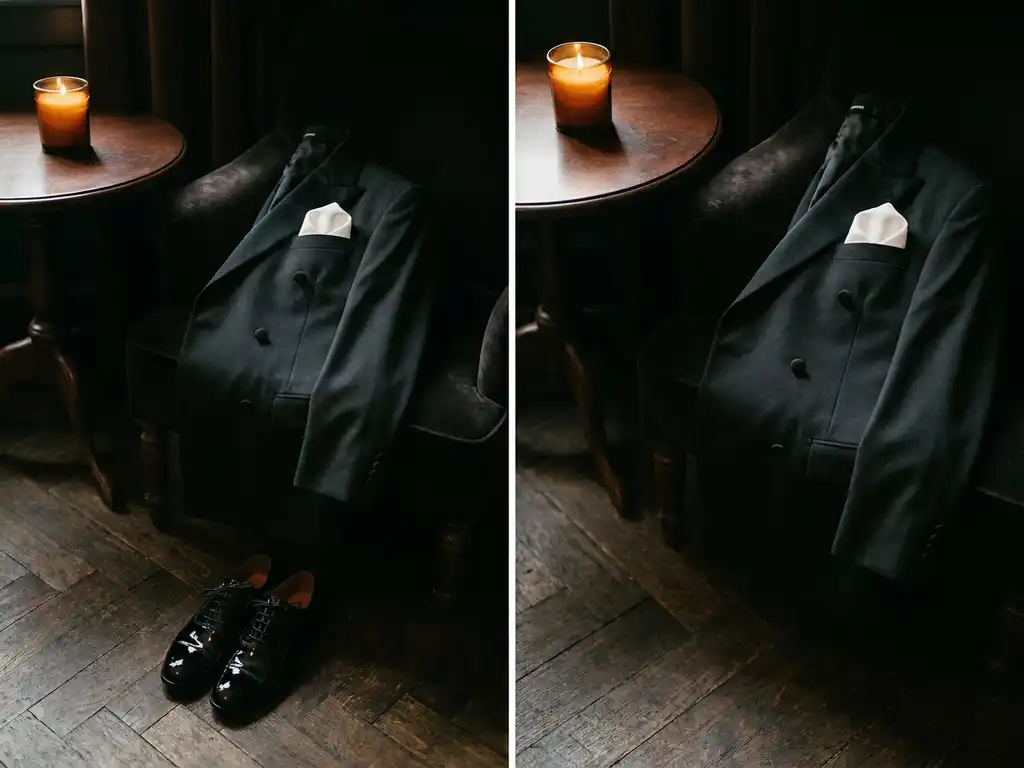 Zwart dubbелrijig smoking jasje op fluwelen stoel met wit pochet, zwarte lakleren Oxfords op donkere visgraathouten vloer in kaarslicht.